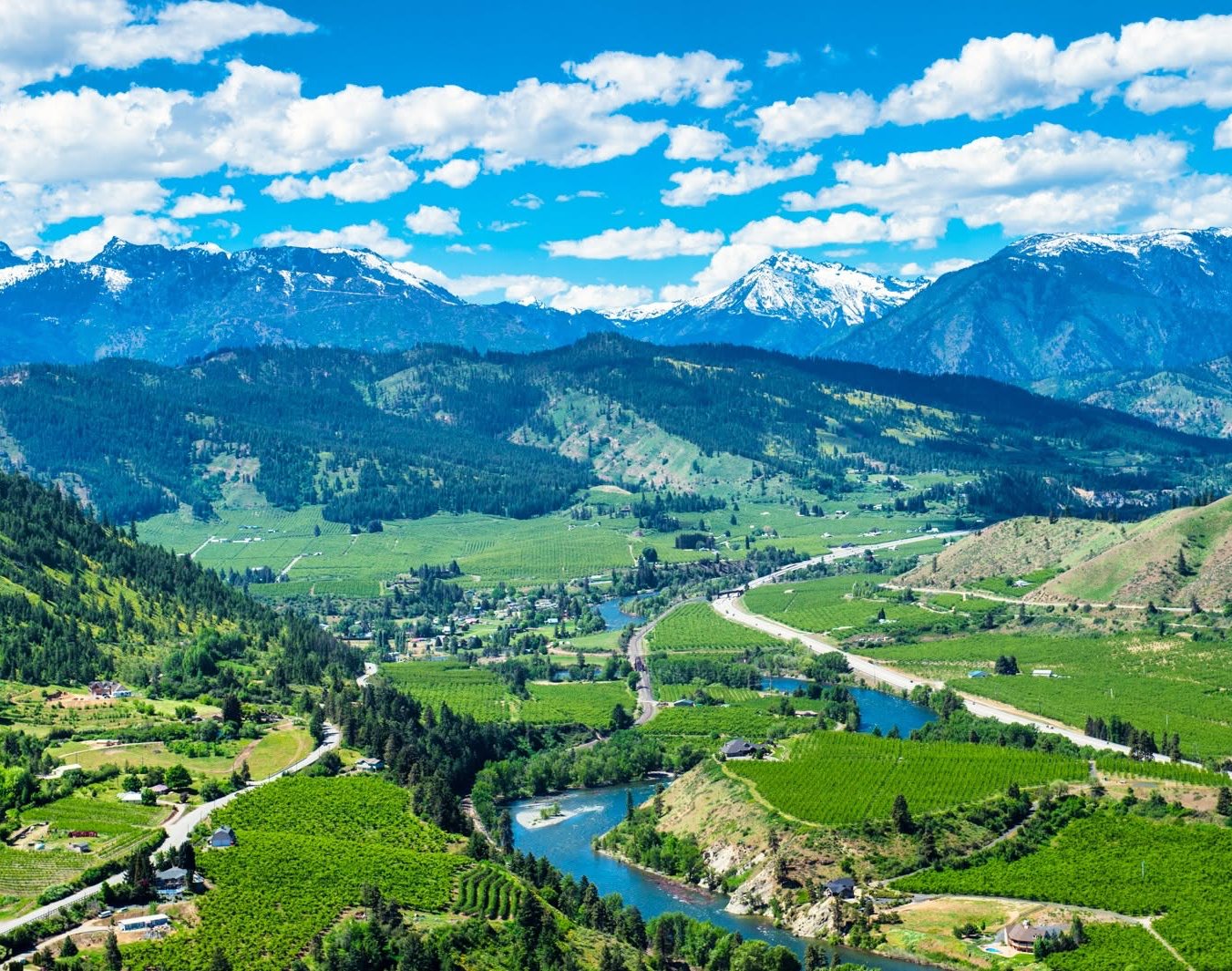 The Wenatchee River winding through orchards and small acreage below the Cascades near Peshastin, Washington.